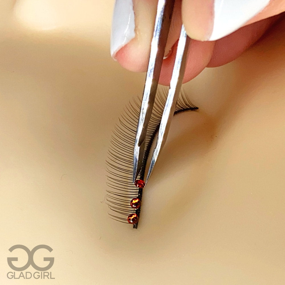 Crystals applied to lash extensions