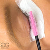 Silicone Pink Spoolie brushing eyelash extensions during service